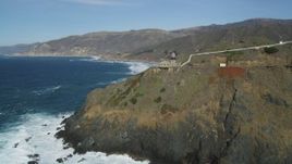 5K aerial stock footage of flying by the Point Sur Light Station on coastal cliffs, Big Sur, California Aerial Stock Footage | DFKSF16_090