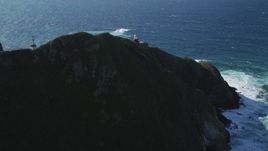 5K aerial stock footage of approaching the Point Sur Light Station, above the coastline, Big Sur, California Aerial Stock Footage | DFKSF16_092
