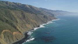 5K aerial stock footage of panning across coastal cliffs and a beach, Big Sur, California Aerial Stock Footage | DFKSF16_109