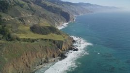 5K aerial stock footage of tilting from ocean kelp to reveal coastal cliffs, Big Sur, California Aerial Stock Footage | DFKSF16_110