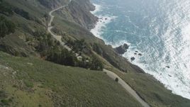 5K aerial stock footage fly over Highway 1 winding atop cliffs, tilt to reveal ocean views, Big Sur, California Aerial Stock Footage | DFKSF16_117