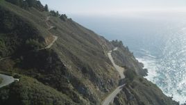 5K aerial stock footage tilt from Highway 1 atop coastal cliffs to wider ocean view, Big Sur, California Aerial Stock Footage | DFKSF16_118