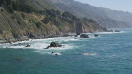 5K aerial stock footage of flying low by steep coastal cliffs and rock formations, Big Sur, California Aerial Stock Footage | DFKSF16_127