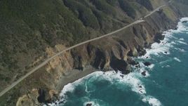 5K aerial stock footage tilt Highway 1 coastal road, small beach and coastal cliffs, Big Sur, California Aerial Stock Footage | DFKSF16_131