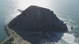 5K aerial stock footage of flying by Morro Rock overlooking the ocean in Morro Bay, California Aerial Stock Footage | DFKSF16_155