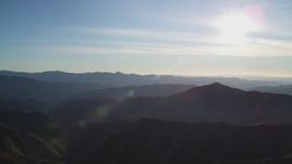 5K aerial stock footage flyby mountains, sun in the background, San Luis Obispo County, California Aerial Stock Footage | DFKSF17_016