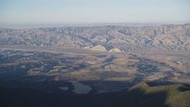 5K aerial stock footage of flying by Cuyama Valley and Caliente Mountain Range, San Luis Obispo, California Aerial Stock Footage | DFKSF17_020