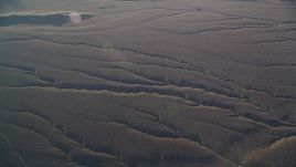 5K aerial stock footage of flying by deep cracks in the desert, Cuyama Valley, California Aerial Stock Footage | DFKSF17_022
