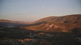 5K aerial stock footage of flying by mountains with moon above, Los Padres National Forest, California, sunset Aerial Stock Footage | DFKSF17_054