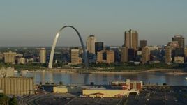5.7K aerial stock footage of The Arch and skyline, passing by a casino by the Mississippi River, sunrise, Downtown St. Louis, Missouri Aerial Stock Footage | DX0001_000512
