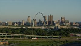 5.7K aerial stock footage descending below the interstate looking toward the Arch and skyline, sunrise, Downtown St. Louis, Missouri Aerial Stock Footage | DX0001_000522