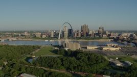 5.7K aerial stock footage of the Arch and skyline seen from a park in East St. Louis, sunrise, Downtown St. Louis, Missouri Aerial Stock Footage | DX0001_000535