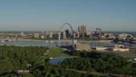 5.7K aerial stock footage of the Arch and skyline seen from a park, sunrise, Downtown St. Louis, Missouri Aerial Stock Footage | DX0001_000540