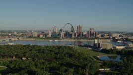 5.7K aerial stock footage of a park with view of the Arch and skyline at sunrise, Downtown St. Louis, Missouri Aerial Stock Footage | DX0001_000541