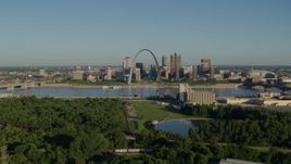 5.7K aerial stock footage of skyline and Arch seen from a park along the river at sunrise, Downtown St. Louis, Missouri Aerial Stock Footage | DX0001_000542