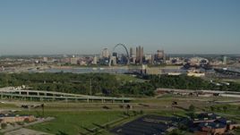 5.7K aerial stock footage of freeway and park in East St. Louis, looking toward Arch and skyline, sunrise, Downtown St. Louis, Missouri Aerial Stock Footage | DX0001_000549