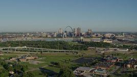 5.7K aerial stock footage of school and interstate in East St. Lous toward skyline and Arch, sunrise, Downtown St. Louis, Missouri Aerial Stock Footage | DX0001_000551