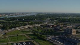 5.7K aerial stock footage of freeways and a police station with views of a river, sunrise, East St Louis, Illinois Aerial Stock Footage | DX0001_000554