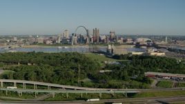 5.7K aerial stock footage of interstates and park in East St. Louis, and skyline with Arch in Downtown St. Louis, Missouri Aerial Stock Footage | DX0001_000564