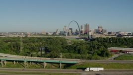 5.7K aerial stock footage descending below freeways with skyline and Arch in the distance, Downtown St. Louis, Missouri Aerial Stock Footage | DX0001_000565