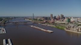 5.7K aerial stock footage of barges in the river near the Gateway Arch in Downtown St. Louis, Missouri Aerial Stock Footage | DX0001_000576