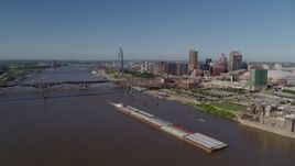 5.7K aerial stock footage of barges in the Mississippi River near Downtown St. Louis, Missouri Aerial Stock Footage | DX0001_000578