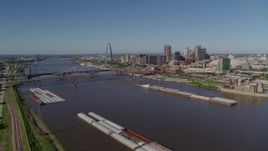 5.7K aerial stock footage reverse of barges and the Mississippi River near Downtown St. Louis, Missouri Aerial Stock Footage | DX0001_000579