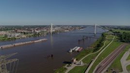 5.7K aerial stock footage of barges in the river and a cable-stayed bridge, St. Louis, Missouri Aerial Stock Footage | DX0001_000591