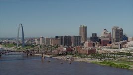5.7K aerial stock footage approaching riverfront office buildings near a bridge with Arch in the background, Downtown St. Louis, Missouri Aerial Stock Footage | DX0001_000592
