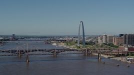 5.7K aerial stock footage of the Gateway Arch between bridges in Downtown St. Louis, Missouri Aerial Stock Footage | DX0001_000595