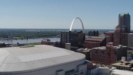 5.7K aerial stock footage of the Gateway Arch seen while descending by stadium in Downtown St. Louis, Missouri Aerial Stock Footage | DX0001_000639
