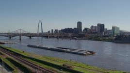 5.7K aerial stock footage of Downtown St. Louis, Missouri seen from train tracks in East St. Louis, Illinois Aerial Stock Footage | DX0001_000655
