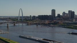 5.7K aerial stock footage ascend to reveal the Gateway Arch and Downtown St. Louis, Missouri across the river Aerial Stock Footage | DX0001_000667
