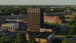 5.7K aerial stock footage of an abandoned brick building at sunset in East St. Louis, Illinois Aerial Stock Footage | DX0001_000669
