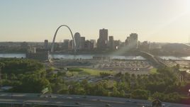 5.7K aerial stock footage of the Gateway Arch and Downtown St. Louis at sunset, seen from East St. Louis, Illinois Aerial Stock Footage | DX0001_000680