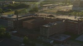 5.7K aerial stock footage orbit abandoned hospital at sunset in East St. Louis, Illinois Aerial Stock Footage | DX0001_000682