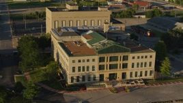 5.7K aerial stock footage circle and fly away from a federal courthouse at sunset, East St. Louis, Illinois Aerial Stock Footage | DX0001_000692