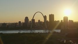 5.7K aerial stock footage the Arch and Downtown St. Louis, Missouri skyline with setting sun in background Aerial Stock Footage | DX0001_000701