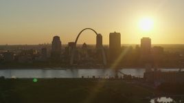 5.7K aerial stock footage of the setting sun behind the Gateway Arch and Downtown St. Louis, Missouri Aerial Stock Footage | DX0001_000708