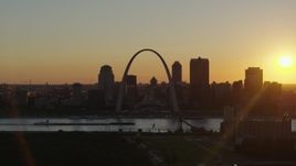 5.7K aerial stock footage ascend for a view of the Gateway Arch and Downtown St. Louis, Missouri at sunset Aerial Stock Footage | DX0001_000712