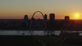 5.7K aerial stock footage of the setting sun behind the Gateway Arch and Downtown St. Louis, Missouri Aerial Stock Footage | DX0001_000723