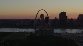 5.7K aerial stock footage flyby the Gateway Arch and Downtown St. Louis, Missouri in silhouette at sunset Aerial Stock Footage | DX0001_000730