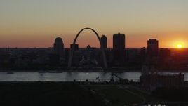 5.7K aerial stock footage of the Downtown St. Louis, Missouri skyline in silhouette at sunset Aerial Stock Footage | DX0001_000733