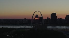 5.7K aerial stock footage of passing the famous Arch across the river in Downtown St. Louis, Missouri, sunset Aerial Stock Footage | DX0001_000736