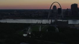 5.7K aerial stock footage of the Gateway Geyser with the Arch across the river, Downtown St. Louis, Missouri, twilight Aerial Stock Footage | DX0001_000741