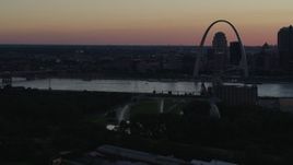 5.7K aerial stock footage the Gateway Geyser and Gateway Arch at sunset, Downtown St. Louis, Missouri, twilight Aerial Stock Footage | DX0001_000742