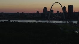 5.7K aerial stock footage of a stationary view of the Gateway Arch and Downtown St. Louis, Missouri, twilight, before descending Aerial Stock Footage | DX0001_000748