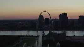 5.7K aerial stock footage of a stationary view of the Gateway Geyser, and the Arch in Downtown St. Louis, Missouri, twilight Aerial Stock Footage | DX0001_000755
