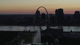 5.7K aerial stock footage ascend over the Gateway Geyser for view of the Arch in Downtown St. Louis, Missouri, twilight Aerial Stock Footage | DX0001_000758