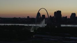 5.7K aerial stock footage fly way from Gateway Arch in Downtown St. Louis, Missouri, twilight, and the Gateway Geyser Aerial Stock Footage | DX0001_000759